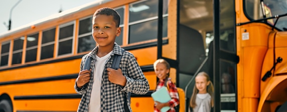 Children getting off of a school bus