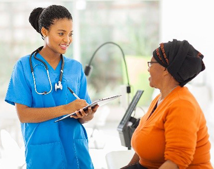 Healthcare worker chatting with patient