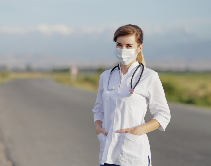 Doctor standing in front of a road
