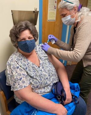 A patient at Ammonoosuc Community Health Services receives the COVID-19 vaccine.