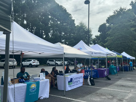 An health care exhibit showing a number of different tents from health care organizations.