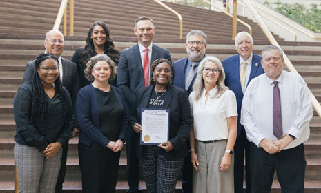 Pictured top left: Pete Metizner, Commissioner; Sara Lopez Commissioner; Ryan Baty, Commissioner; Jim Howell, Commissioner; David Dennis, Commissioner. Bottom left: Myesha Kennedy, HRSA IEA; Amy Feimer, Hunter Health CEO; Teresa Lovelady, HealthCore Clinic CEO, Dr. Julie Elder, Gracemed Interim CEO and CMO; Scott Anglemeyer, Director of Policy Research and Analysis, Community Care Network of Kansas.