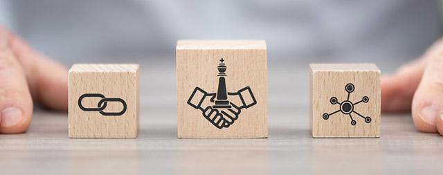 Wooden blocks with various symbols are displayed on a table