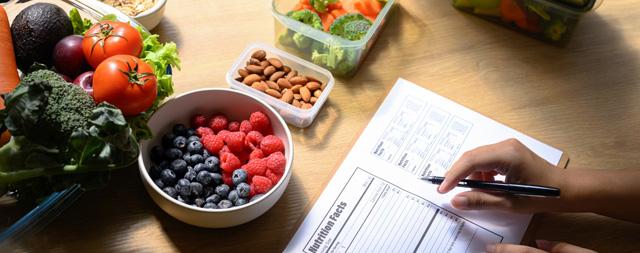 bowl of fruit with notebook