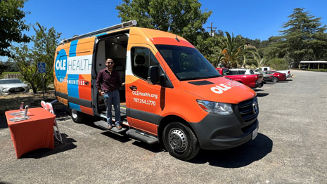 Pictured is Richard Hurtado, Community Outreach Manager, standing in Ole Health’s mobile van.